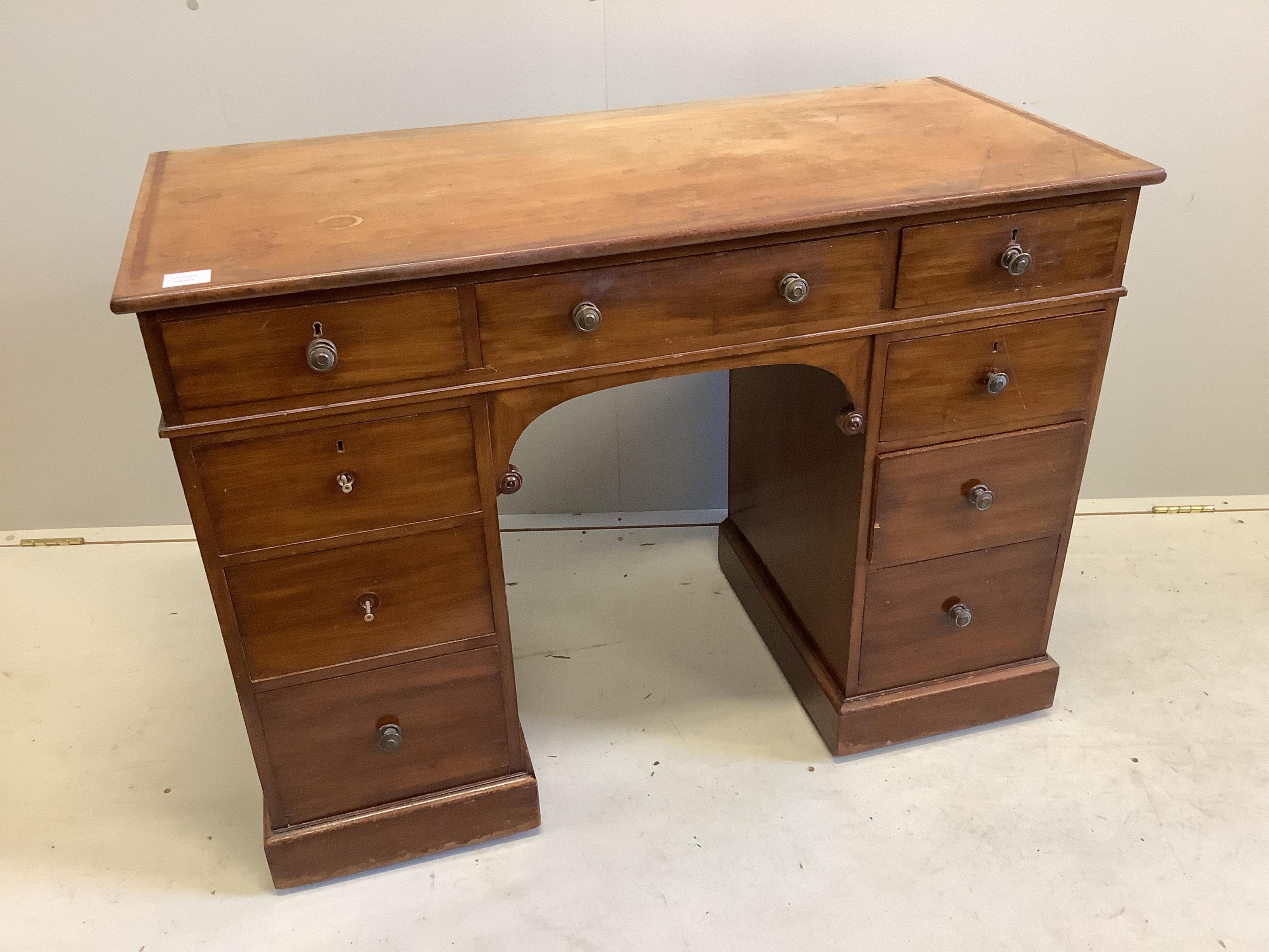 A Victorian mahogany kneehole dressing table, fitted nine small drawers, width 107cm, depth 49cm, height 78cm. Condition - poor to fair